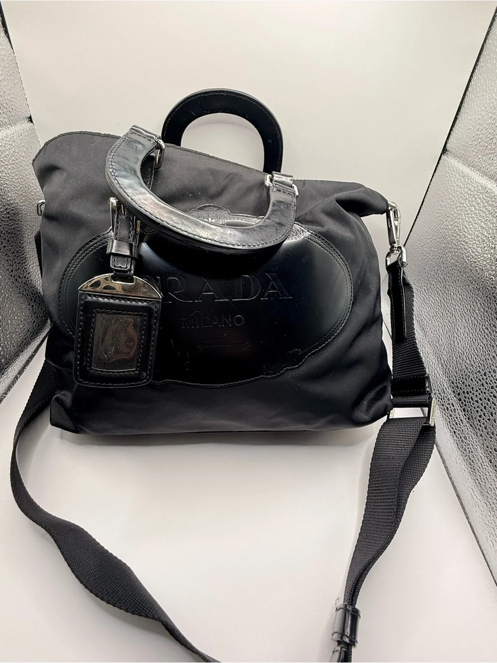 Prada Black Nylon & Leather Bag with Embossed Prada logo.